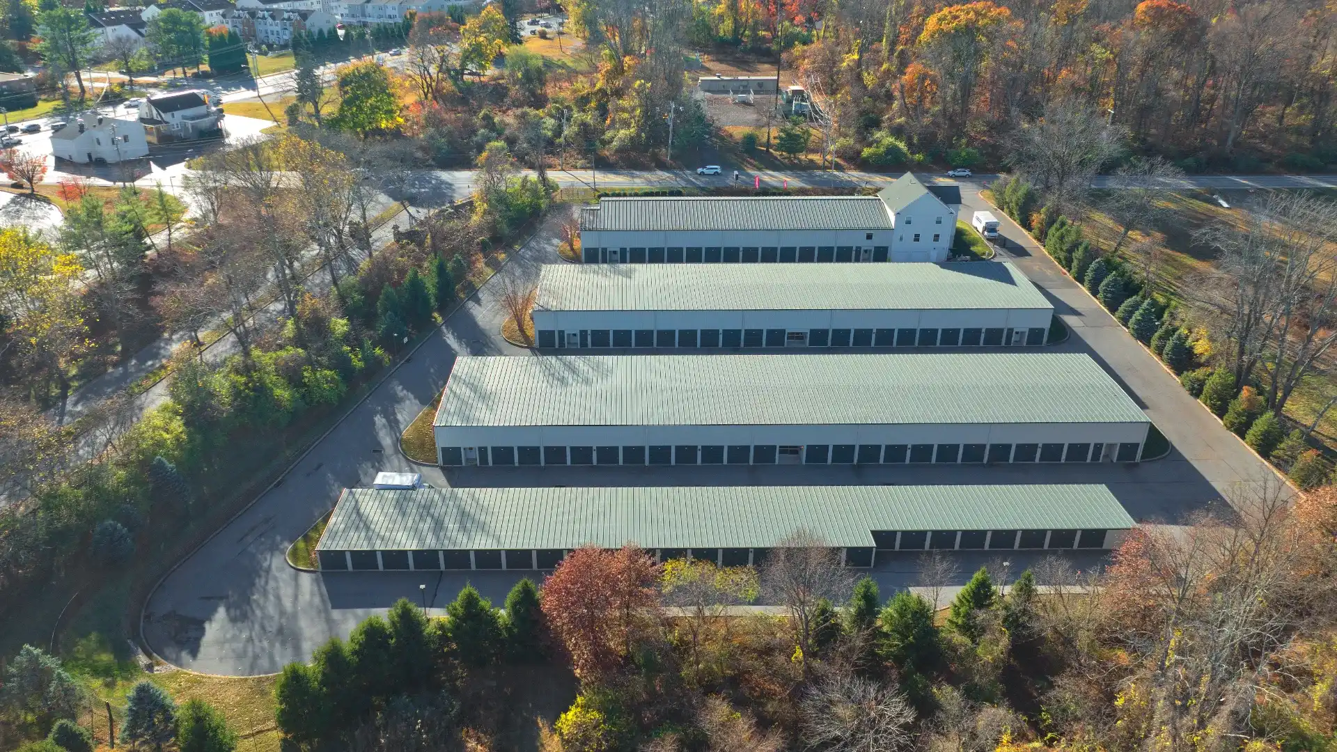 Aerial view of the Glen Mills self-storage facility in Pennsylvania surrounded by autumn foliage